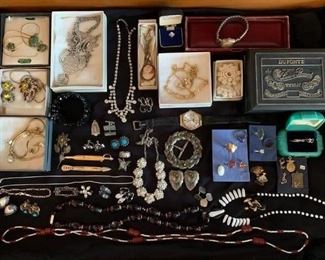 small portion of jewelry to include gold..sterling sliver..Park Lane..rhinestone necklace ..cameo..tie bars..watches..pins..vintage ring box..