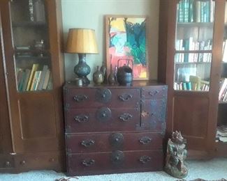 Tansu and vie of the pair of walnut bookcases. Lock is missing on the tansu