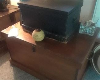 Carved primitive chests are used as end tables and coffee table. There are four in all.