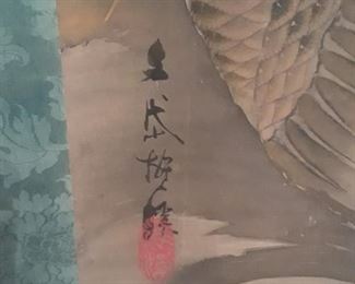 Signature on scroll with koi
