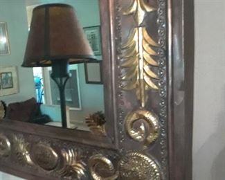 Interesting mirror with ornate metal frame