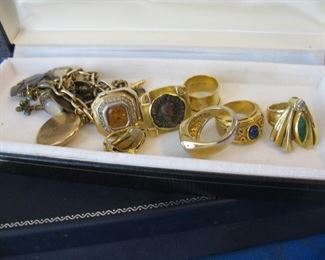 Assorted costume rings, one of a kind designs by Miye for her jewelry line Jantye and watch chain charm bracelet waiting to be displayed.