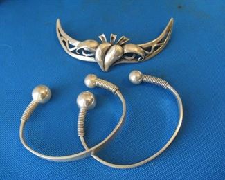 Sterling silver barrett and pair of bangles by Miye whose jewelry is in the Smithsonian.
