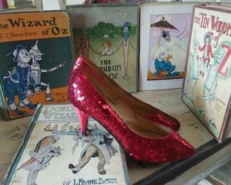 35 Wizard of Oz books and ruby slippers. Sold as a collection. Best offers will be contacted. Various dates and versions gong back to the 1940s. Shown are examples with more colorful covers.