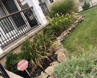 Landscape loose stack stone all around property. 