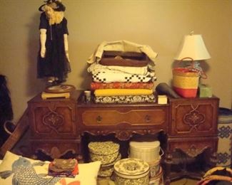 1930's sideboard, quilts and hatboxes full of vintage hats.