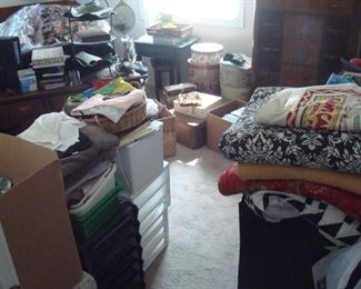 Bedroom items still to be sorted including much clothing, fur coats, quilts and etc.