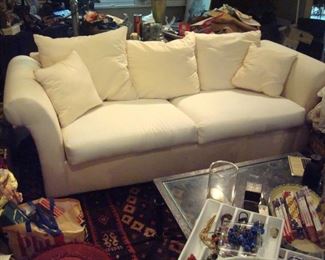 One of a pair of Rowe white sofas with slip covers.