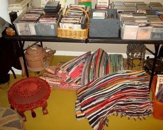 Some of the hundreds cds. and dvds and some hooked rugs.