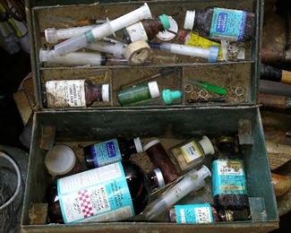 Vintage animal and bird pharmaceutical/veterinarian metal box full of items.