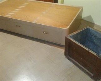 Handmade single bed platform with three under-storage drawers and vintage insulated wooden box.