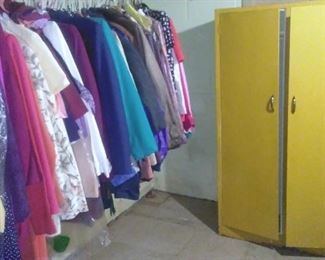 Vintage painted metal cabinet and women's clothing.