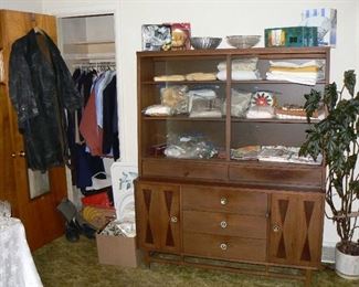 Vintage MCM Stanley Danish-style china hutch, household linens, and WW2 Russian-made leather trench-coat.