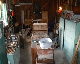 Rustic farm finds, bird caging, boxes and vintage painted cabinets.