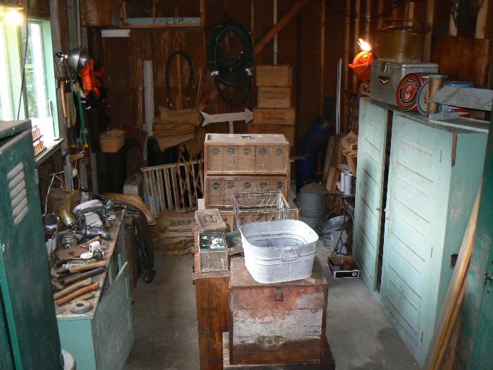 Rustic farm finds, bird caging, boxes and vintage painted cabinets.