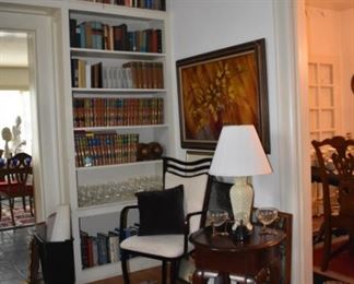 Oil Painting, Modern Metal Chair, Lamp, Decorator Items, Oval Queen Ann Leg Side Table, Books, Stemware