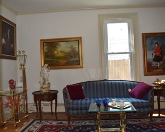 Overview of Parlor. Area Rug,Candle Stand, Brass & Glass End Table, Statuary, Art, Oil Paintings, one by Mitchells, Brass Sconces, Tea Cups, Lg Wood Framed Mirror, Round Wood Scalloped End Tables, Vintage Sofa