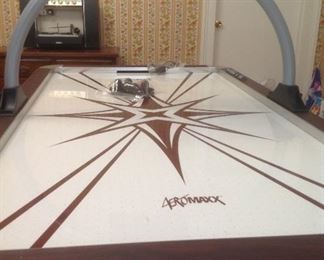 Air powered electronic air hockey table