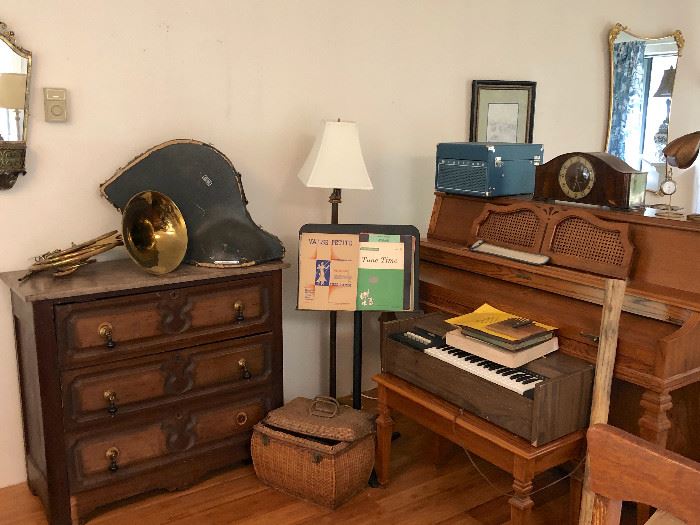 French horn, antique dresser with cool handles, missing one is in the drawer.  
