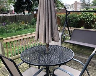 Patio table, 3 matching chairs and umbrella