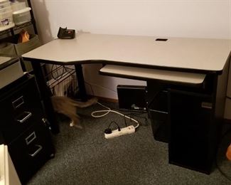 Solid, modern computer desk with pullout keyboard shelf. Black with gray top.  Perfect for your teen's room or the college apartment. 