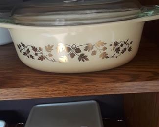 White and gold Pyrex covered casserole. 