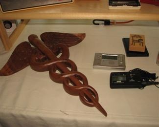Carved wood caduceus