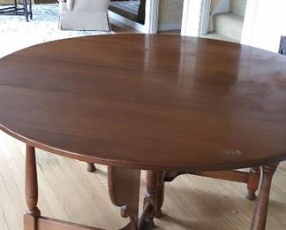 Round dining table with two leaves.  No makers mark 53" round