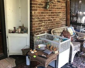 baby bed, white corner cabinet, large area rug