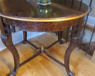 Round Burl Wood Table with Gold Accents and Star-Shaped Cross Stretcher