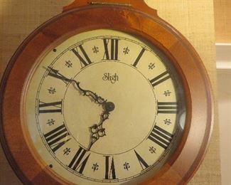 Sligh Grandfather Clock (detail of Face)
Solid Wood hinged Dial Bezel. Classic Hourglass Design. Auburn Cherry Finish