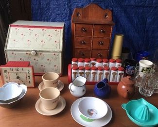 Bread box, spice racks and Nestle cups and saucers