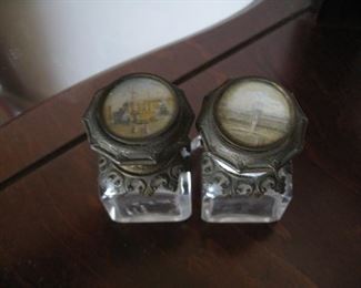 Pair of French perfume bottles, scenes on lids