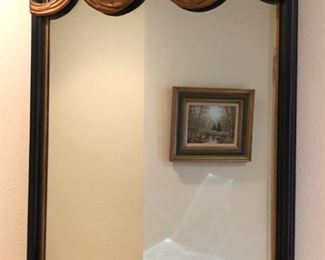 Ebonized neoclassical mirror with giltwood swags