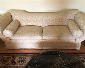 Neoclassical style sofa with custom upholstery and bolsters, circa 1920s-1930s