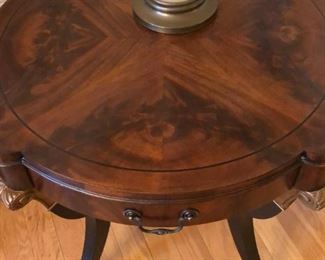 Empire style mahogany center table with book-matched top, circa 1920s-1930s