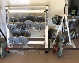 Large set of dumbbells, weights and racks