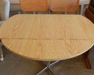 drop leaf table with 4 chairs made by The Breuer chair Company 