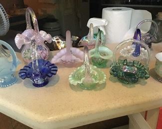 Fenton glass baskets.  Some signed and hand painted
