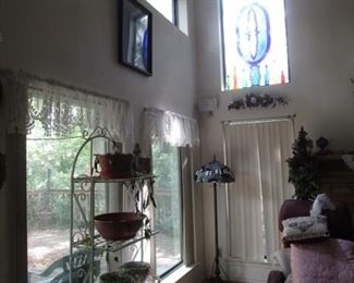 Attention to Blue Stained Glass panel in window.