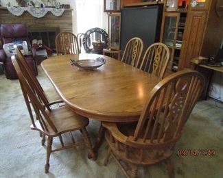 Oak Dining Table with 6 six chairs.  2 Arm, 4 Side