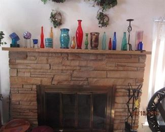 Colored glass bottles and candle holders