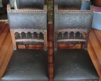 Late 1800s Hand-tooled Leather Chairs, set of six. Leather is in good original condition w/ minimal cracks.