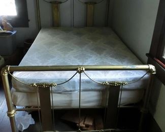 Fancy Brass Bed, can take a full-size mattress.