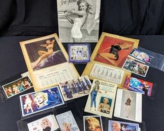 Vintage Marilyn Monroe calendars, hard cover book, stamps and more.