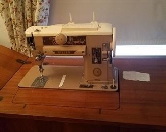 Another great singer sewing machine with cabinet