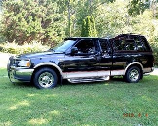 ONLINE AUCTION ITEM #1 - 2000 Ford F-150 Lariat - just over 43,000 original miles, one owner, new tires, leather, power windows / doors / seats, FM/AM CD changer, 5.4 liter engine, custom fiberglass camper top, spray in Rhino liner. Awesome truck!!!