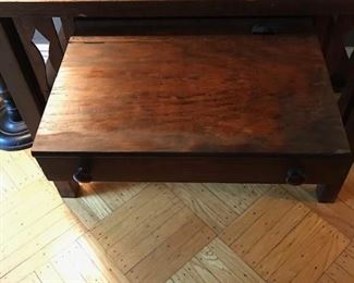 Desk drawer opens to mini compartment with ink well.