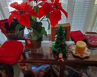 Sofa table and Christmas decorations and Christmas hand towels and potholders 