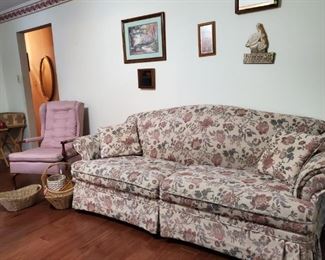 Soft and accent chair; wall hangings and baskets.  